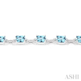 7x7 MM Cushion Shape Blue Topaz and 1/20 Ctw Round Cut Diamond Fashion Bracelet in Sterling Silver