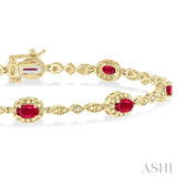 5x3 MM Oval Cut Ruby and 1/20 ctw Single Cut Diamond Bracelet in 10K Yellow Gold