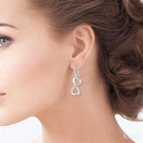1/50 ctw Heart Shape Round Cut Diamond Infinity Earrings in Sterling Silver