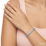 7X5 MM Oval Cut Blue Topaz and 1/10 Ctw Round Cut Diamond Semi-Precious Bracelet in Sterling Silver