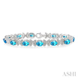 7X5 MM Oval Cut Blue Topaz and 1/10 Ctw Round Cut Diamond Semi-Precious Bracelet in Sterling Silver