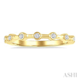 1/10 Ctw Bezel Set Round Cut Diamond Stackable Wedding Band in 14K Yellow Gold