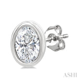 1/5 Ctw Petite Bezel Set Oval Cut Diamond Fashion Stud Earrings in 10K White Gold