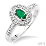 5x3mm oval cut Emerald and 1/10 Ctw Single Cut Diamond Ring in 14K White Gold.