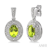 7x5MM Oval Cut Peridot and 1/20 Ctw Single Cut Diamond Earrings in Sterling Silver