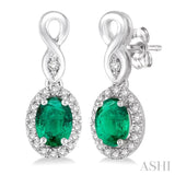 5x3 MM Oval Cut Emerald and 1/6 Ctw Round Cut Diamond Earrings in 14K White Gold
