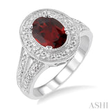 9x7 MM Oval Cut Garnet and 1/20 Ctw Round Cut Diamond Ring in Sterling Silver